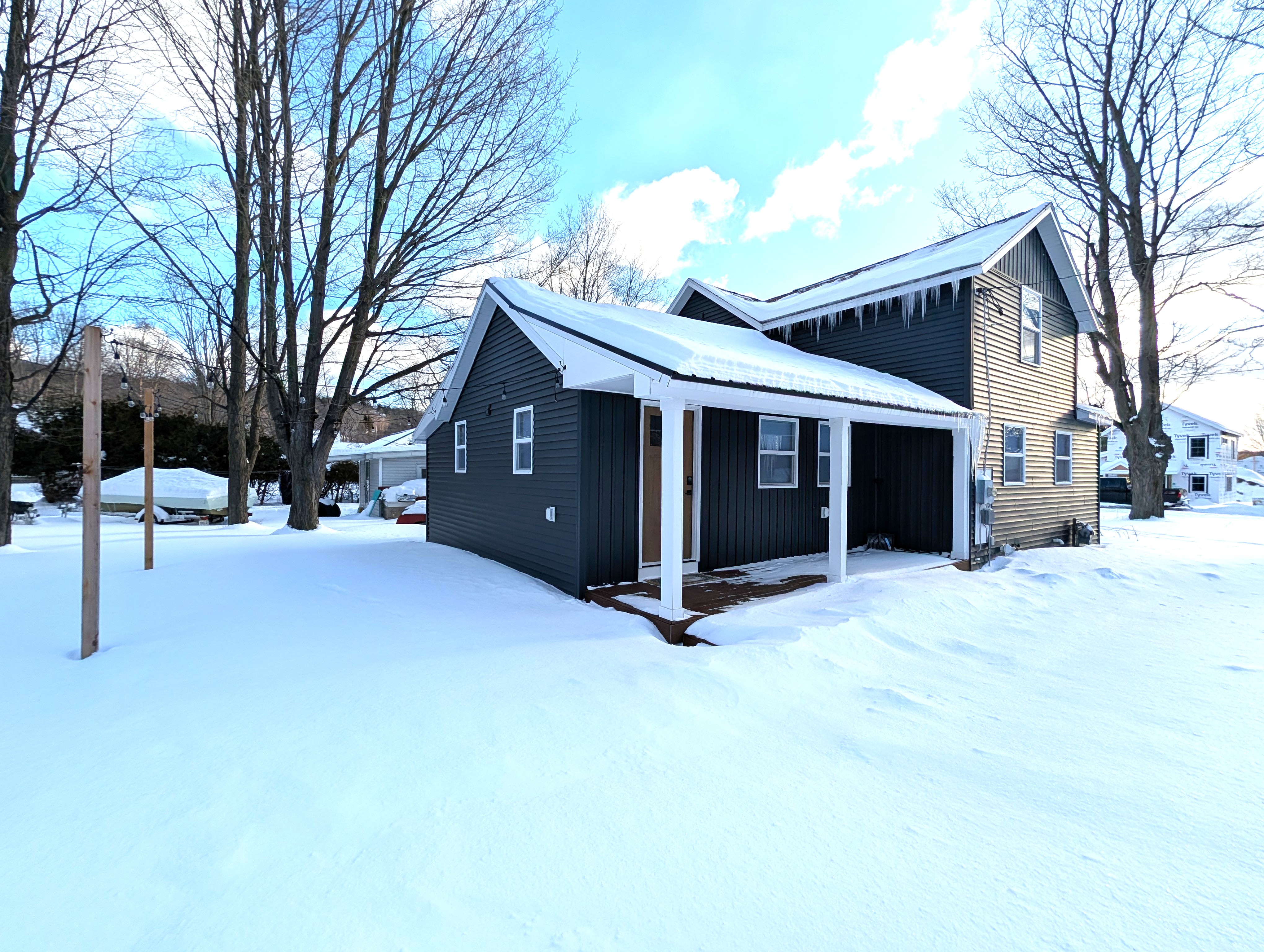 EXTERIOR:  The backyard and side of the house in Winter