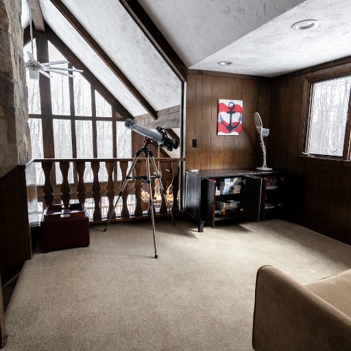 Cozy loft space with comfortable seating and rustic charm—perfect for relaxing or enjoying a quiet moment