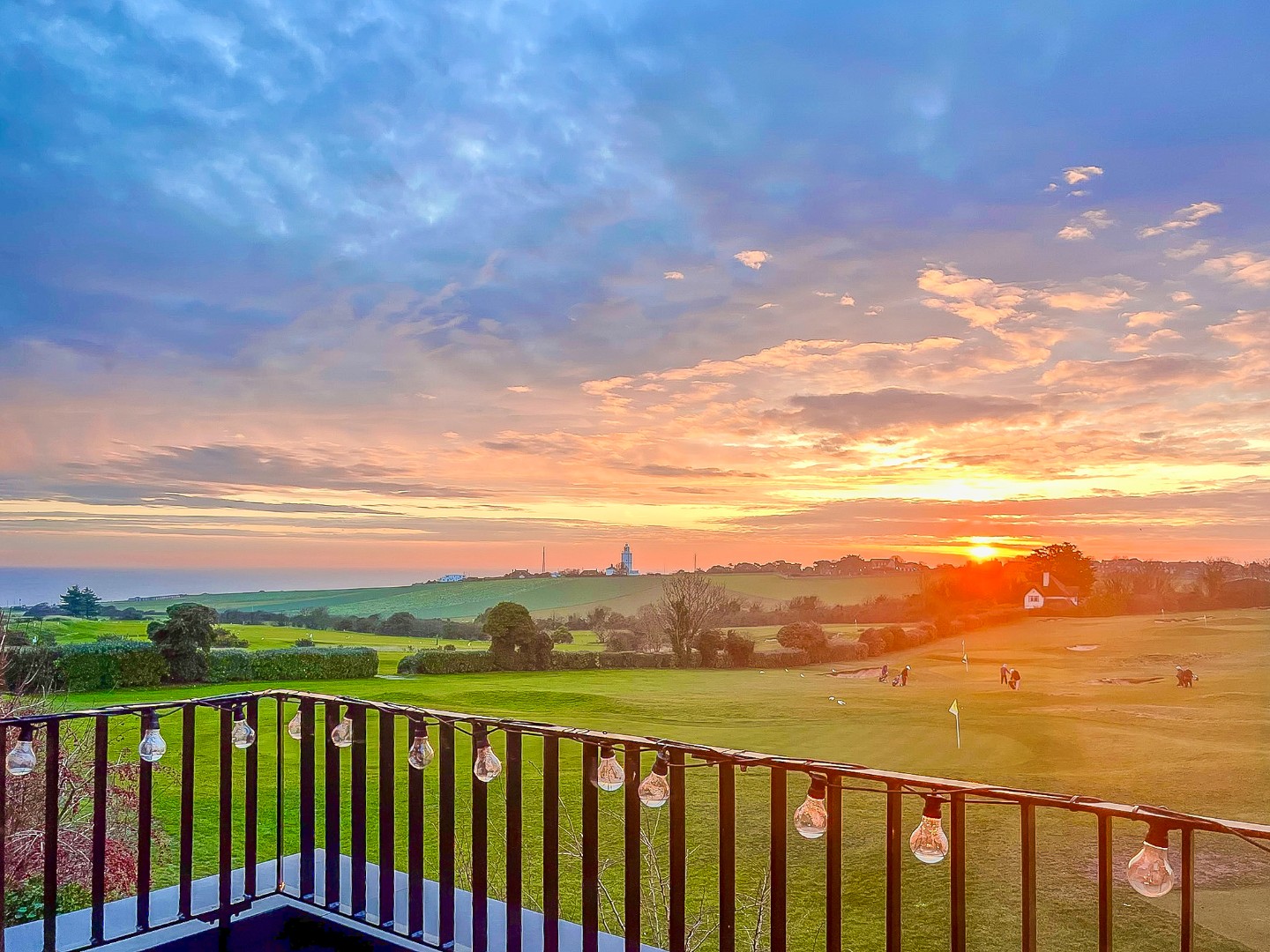 Private balcony with seating and beautiful far-reaching views across the golf course and towards the Kent coastline, perfect for morning coffee or evening drinks.