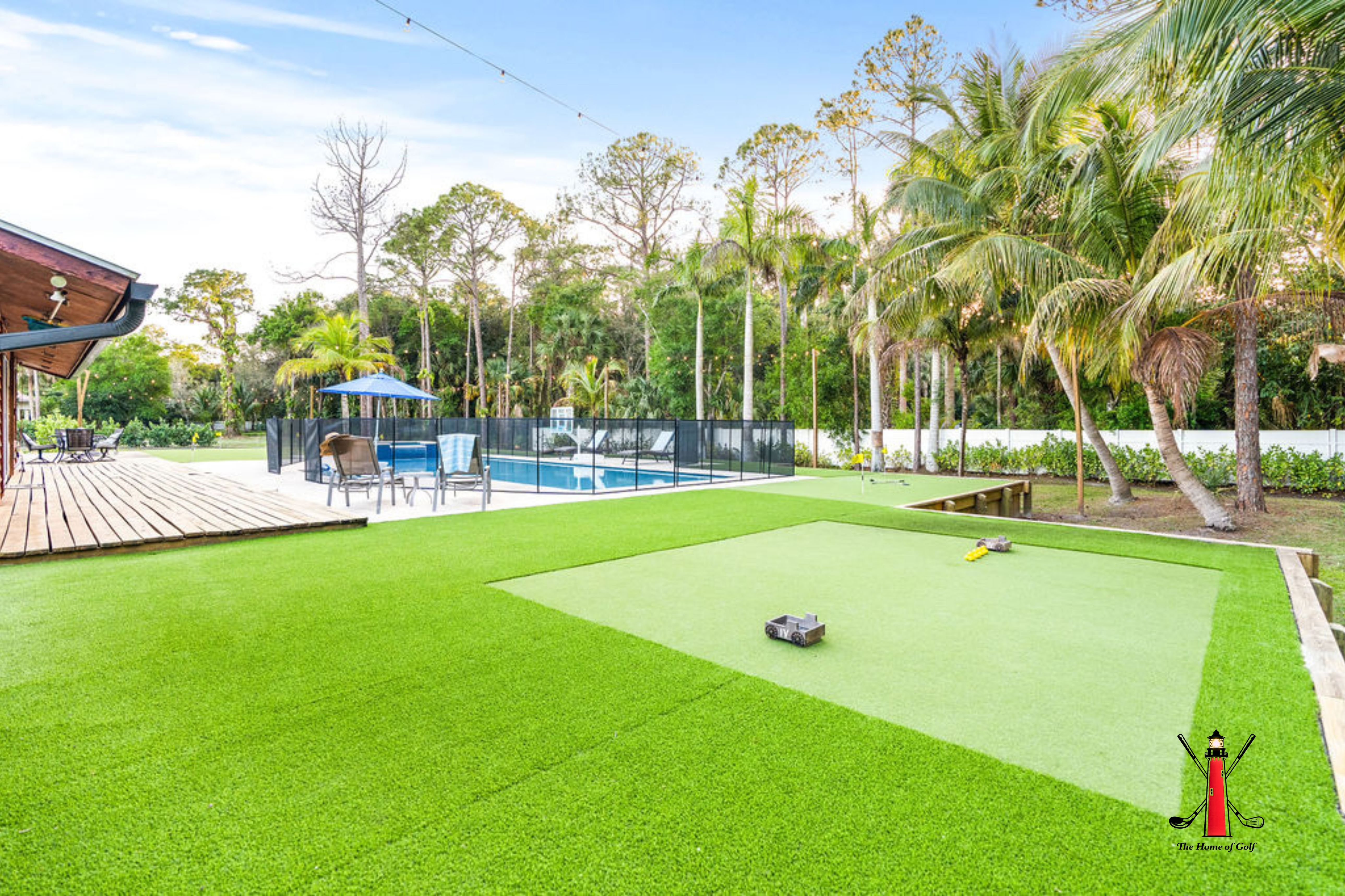 Spacious backyard with a private putting green, pool, and lush tropical vibes! 🌴⛳🏊‍♀️ Your ultimate outdoor playground awaits.