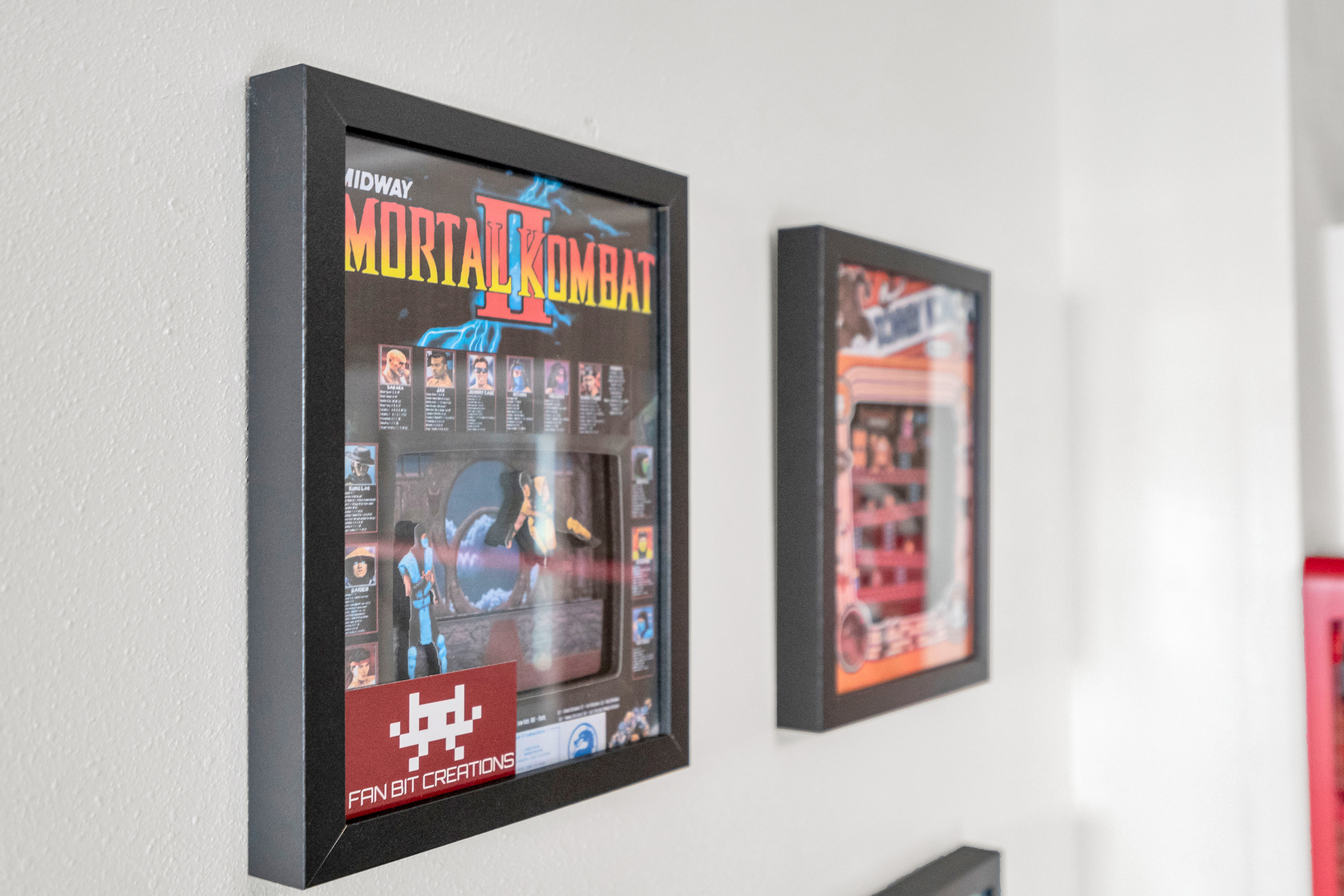 Classic game posters highlighting timeless favourites like Mortal Kombat.