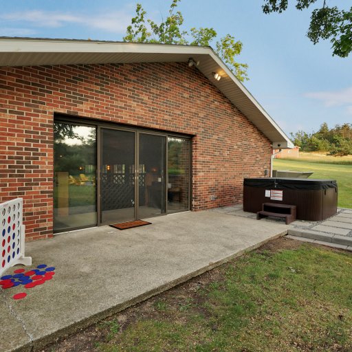 Back patio with direct access to indoor entertainment spaces.
