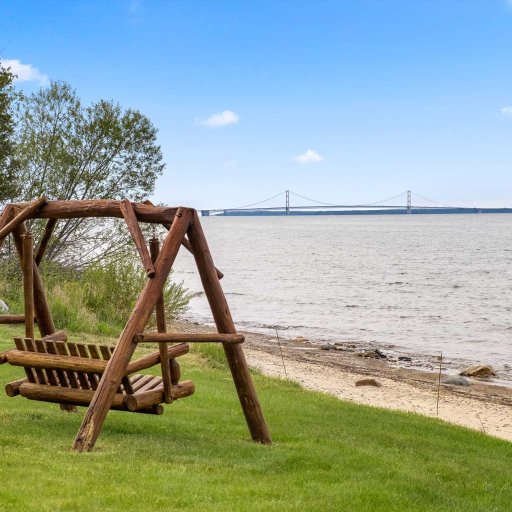 Lawn swing facing the Mackinac Bridge, with the beach a few steps down
