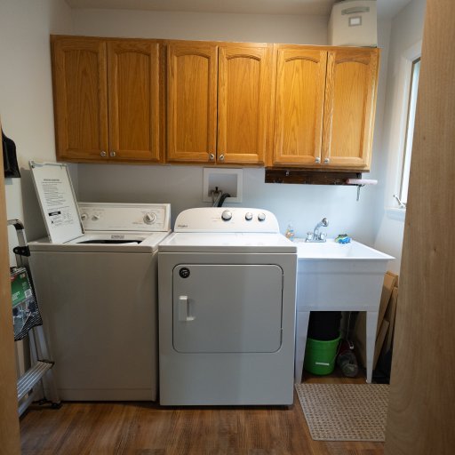 Enjoy the convenience of a full laundry room with a washer, dryer, and extra storage space for longer stays