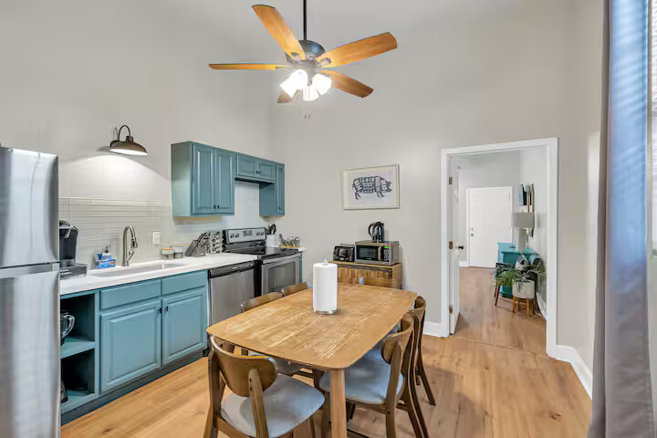 The kitchen is fully equipped with modern appliances, plenty of counter space, and all the essentials for cooking or snacking. Whether you’re whipping up breakfast or enjoying takeout, it’s ready for whatever you need.