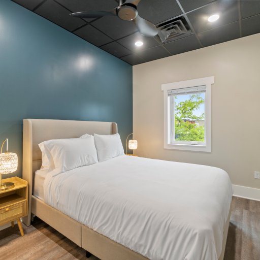 Cozy Queen Bedroom with Natural Light & Designer Touches