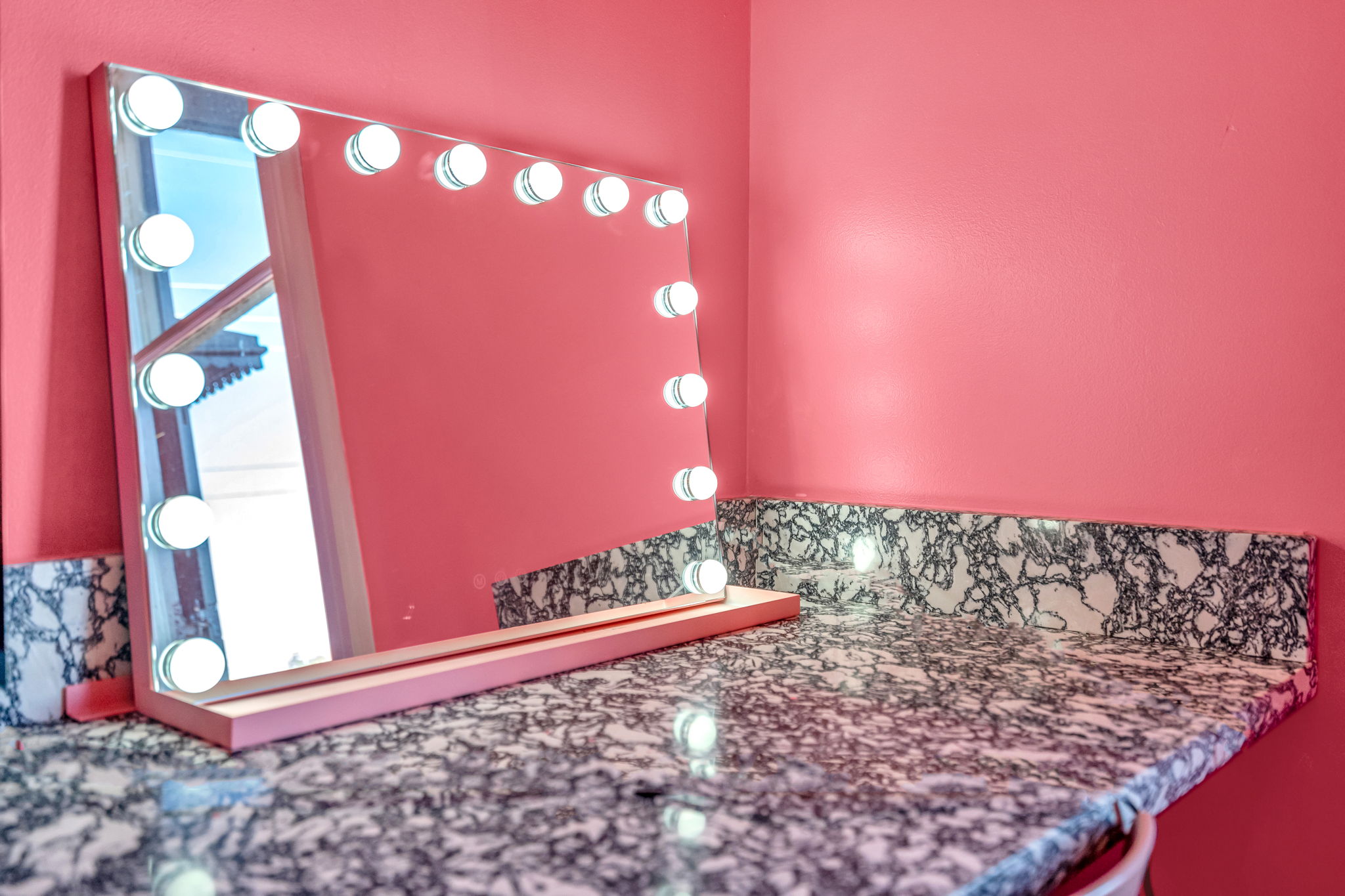 Glam vanity with bright lighting