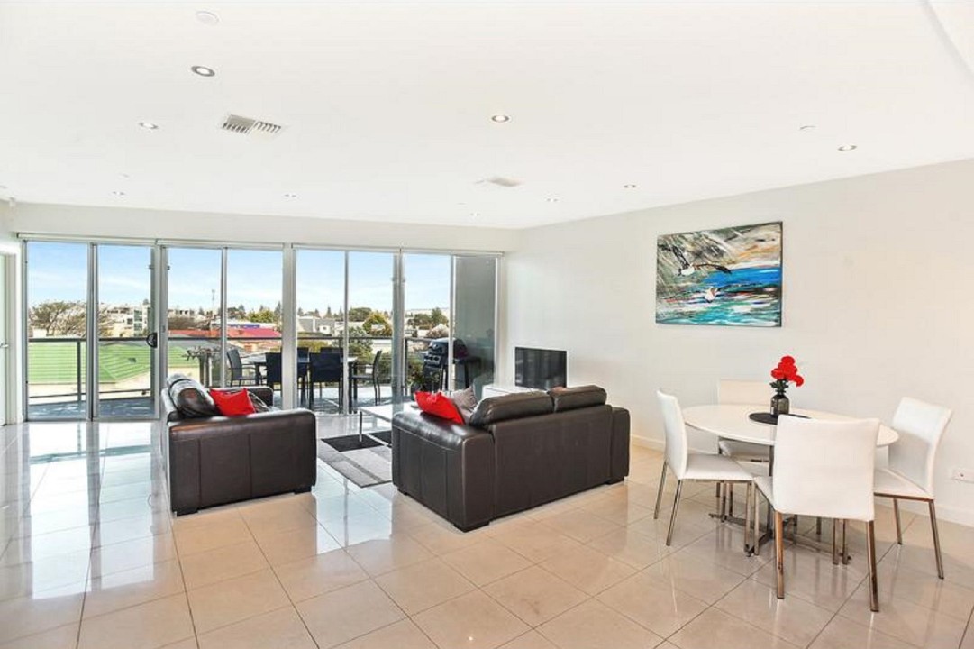 Indoor dining transitions to alfresco balcony seating—ideal for morning coffee or twilight dinners