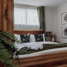 A warmly styled bedroom suite at Two One Two