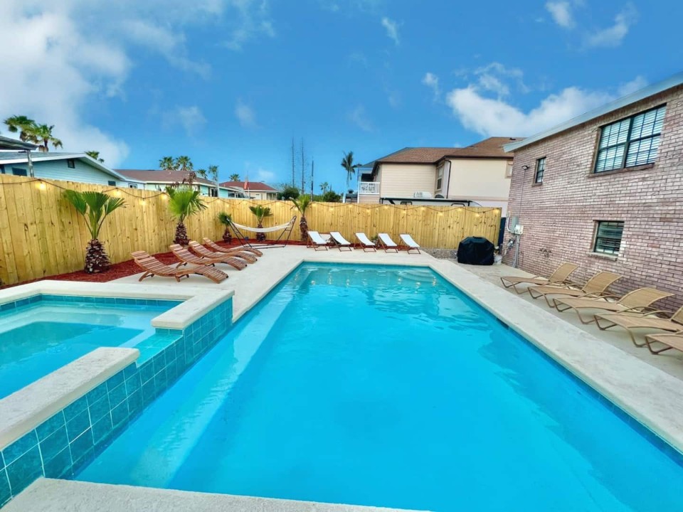 Large private swimming pool and spa with optional heating, surrounded ...