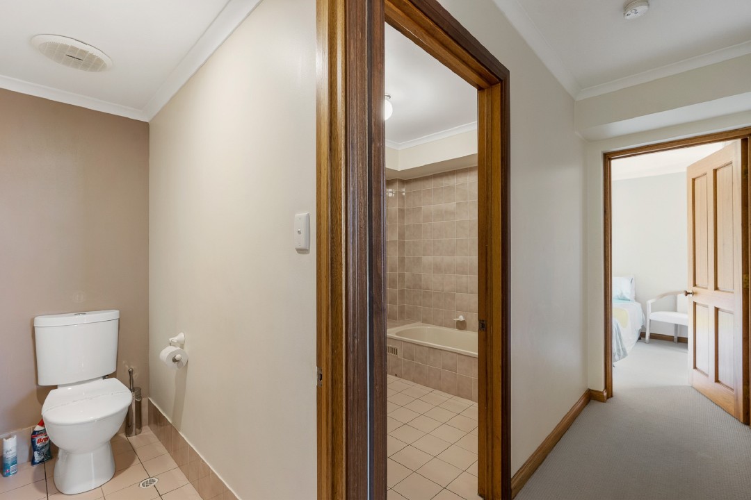 Secondary bathroom is steps from the rear door – ideal for rinsing off sand after beach visits before re-entering the apartment.