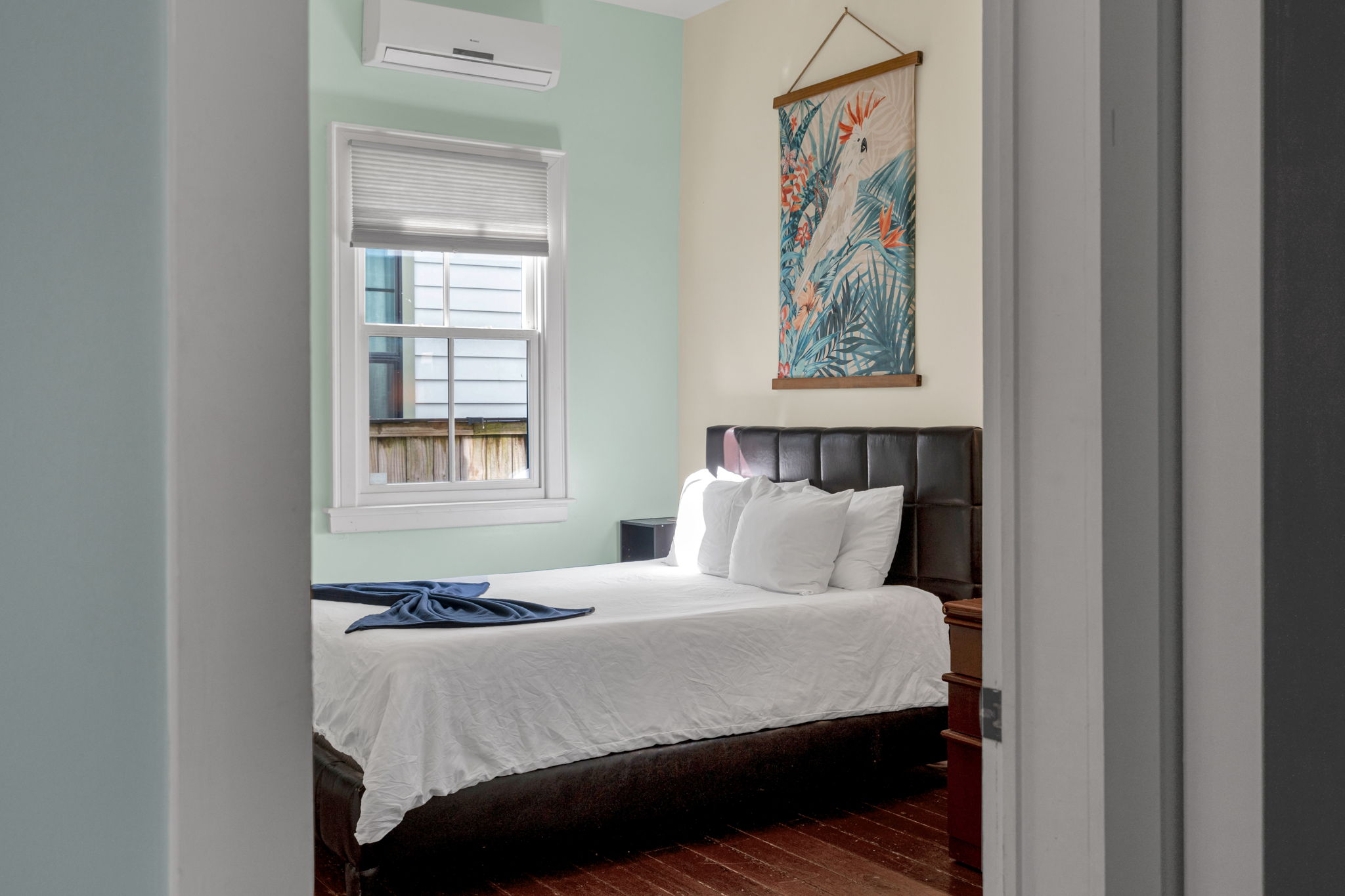 Bedroom-3: Bright bedroom with cozy linens and peaceful natural light.