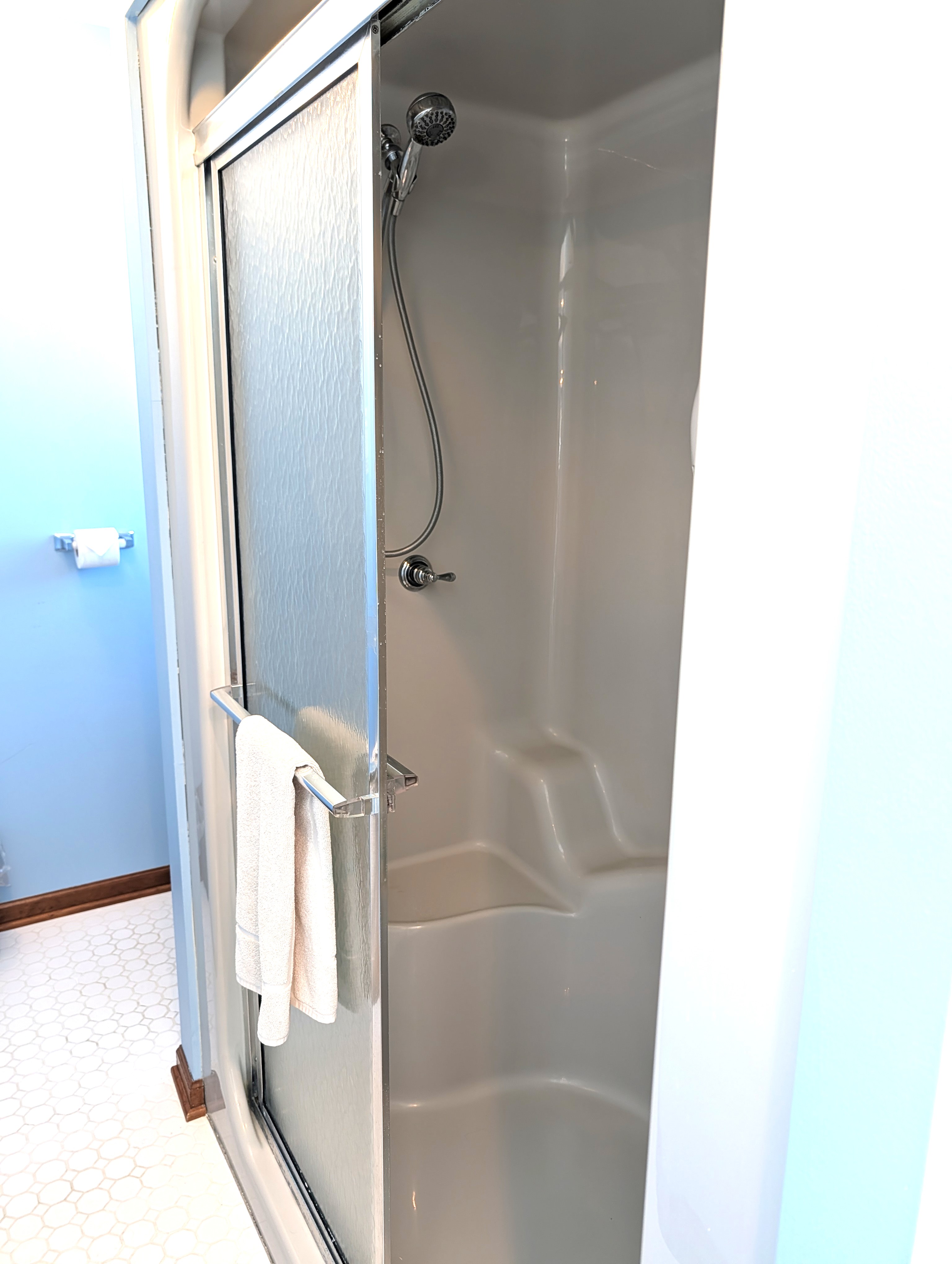 BATHROOM #2 (SECOND FLOOR):  This is a large private ensuite full bathroom for Bedroom #2.  Features a gorgeous jetted bathtub with a great view of Big Platte Lake from the bathtub!