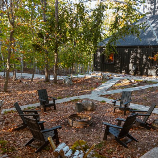 Fire pit with Adirondack chairs for evening gatherings