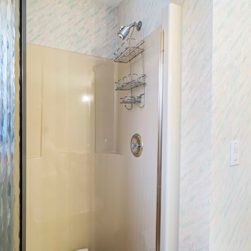 Walk-in glass shower in the second bathroom.