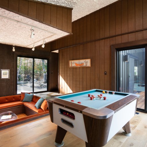 Sunken living room with bumper pool and cozy seating