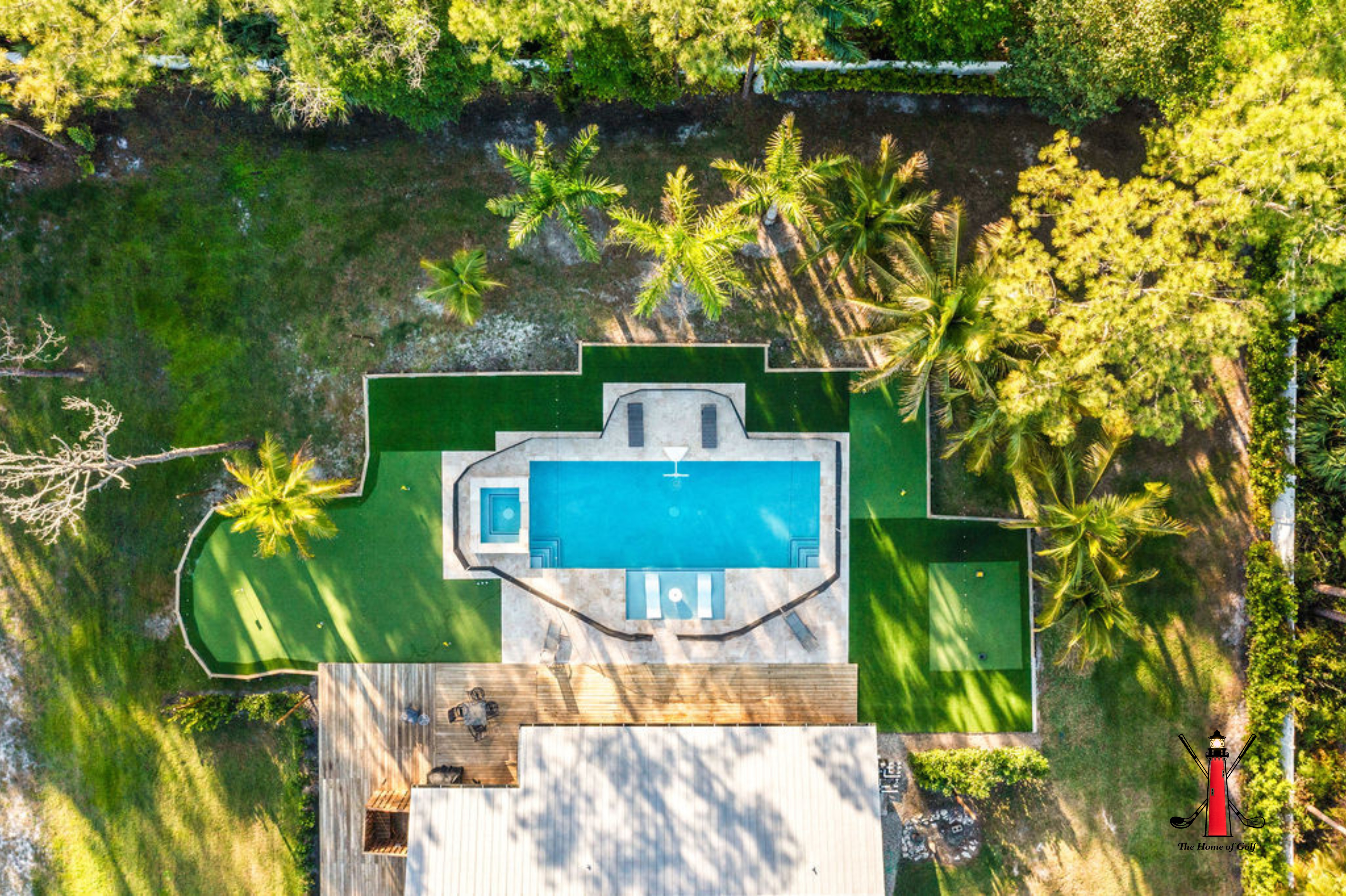 An aerial view of your private oasis! 🌴🏡 See the beautiful pool and lush surroundings from above. ✨
