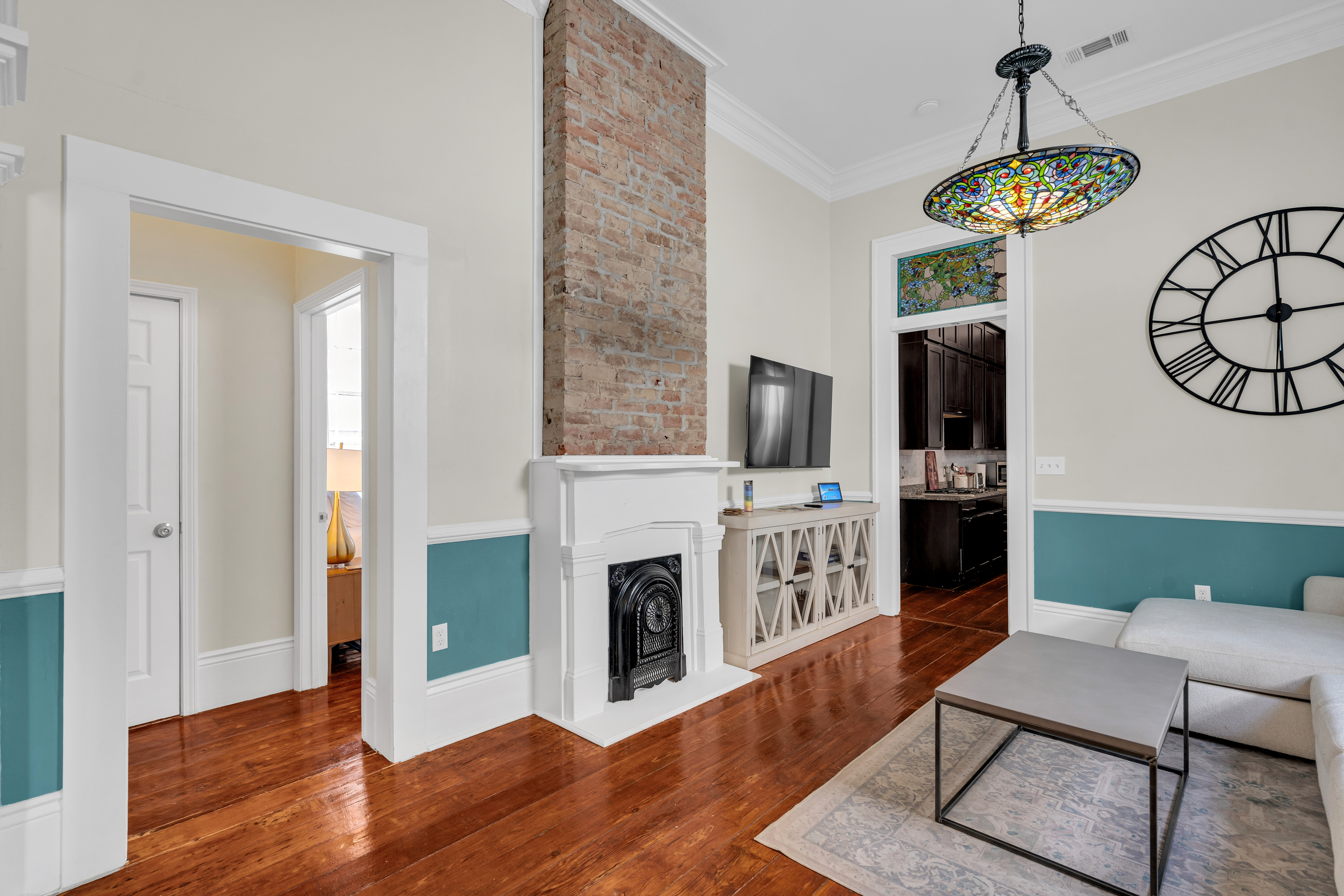 Open-concept living area with chic décor and natural light.