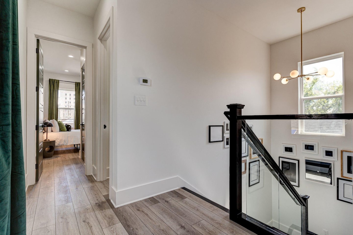 Now let's head upstairs! First, we'll go to the rear bedroom that you get a sneak peek of here!