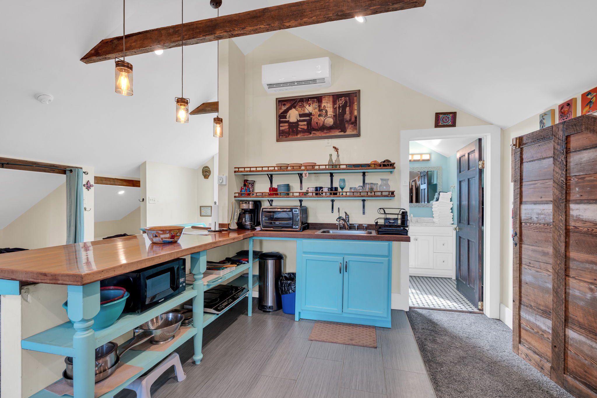 Kitchen | Upstairs : Open-concept kitchen with breakfast bar and vintage flair.