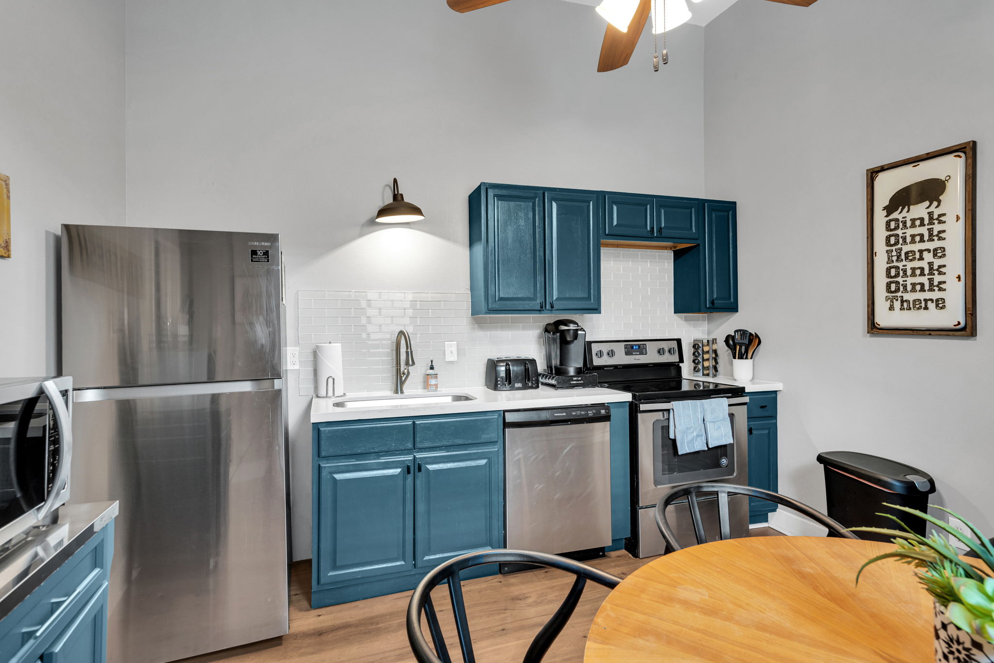 Modern appliances with stylish blue cabinetry