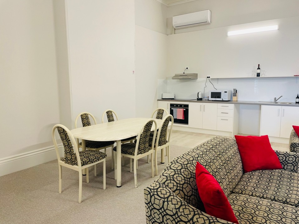 Features open-plan living and dining, a well-equipped kitchen, smart TV, split-system air conditioning, and a sleek, modern bathroom—designed for comfort and convenience.