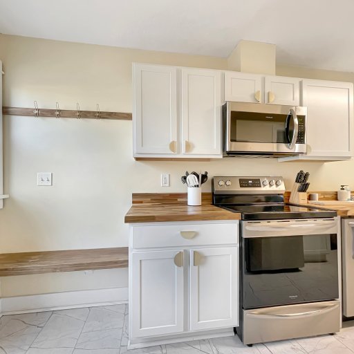 Beautiful kitchen with a welcome area to hang coats and leave shoes
