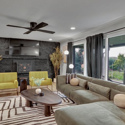 Comfortable living room with large TV and plenty of seating.