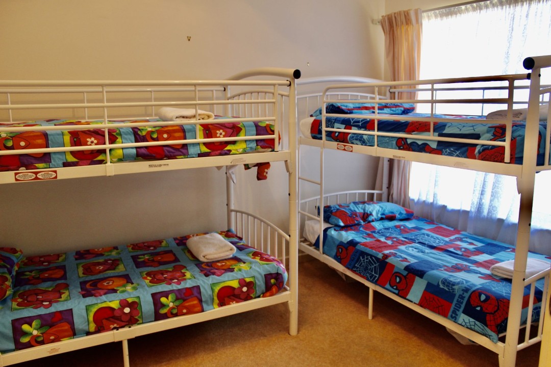 Accommodates up to 8 guests with flexible sleeping arrangements including two sofa beds, making it suitable for multi-generational stays.