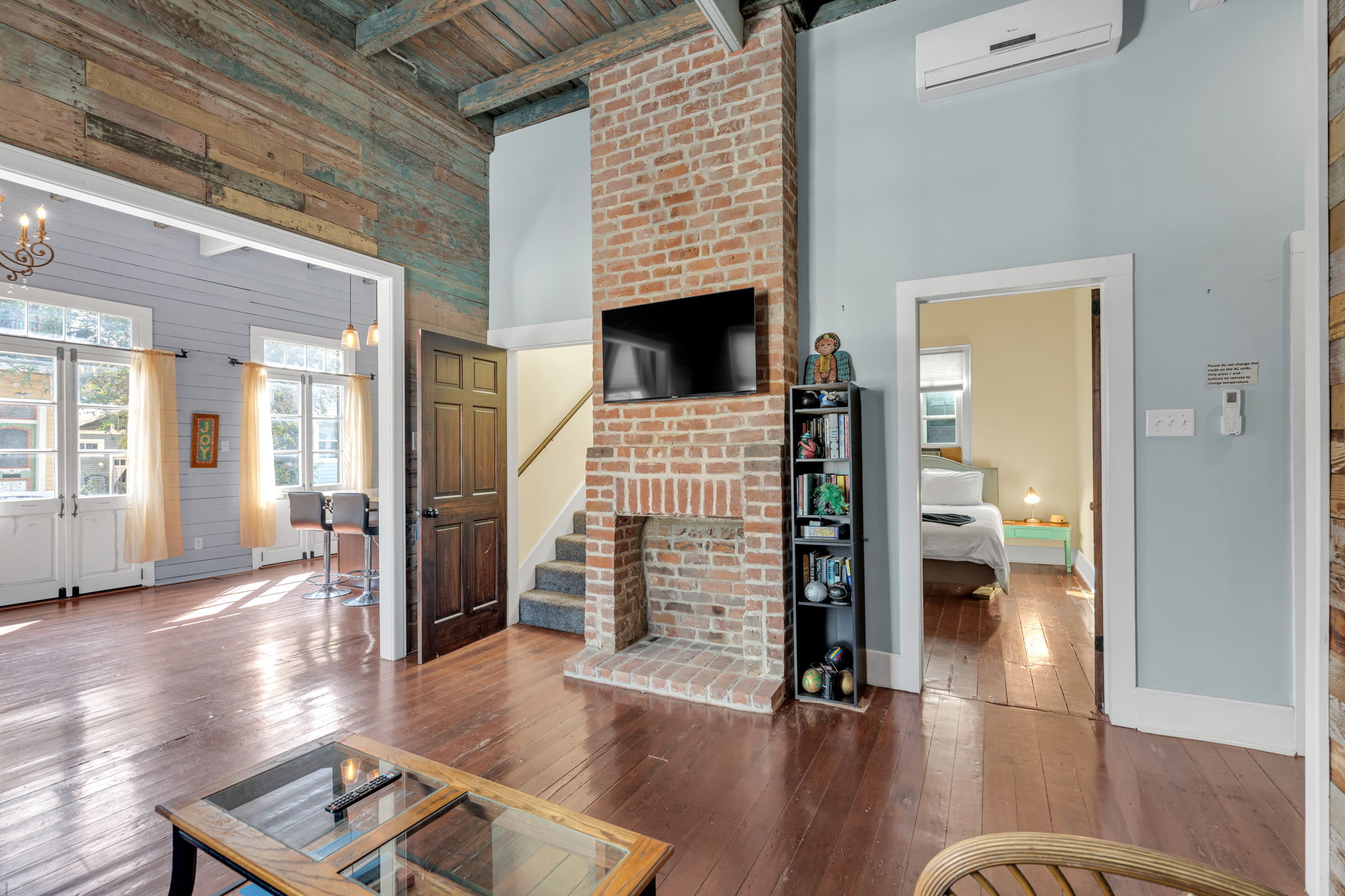 Brick fireplace adds warmth to the modern living space