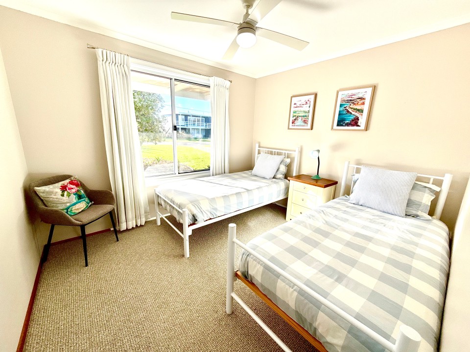 Flexible four-bedroom layout, including a second living area with a sofa bed and deck access