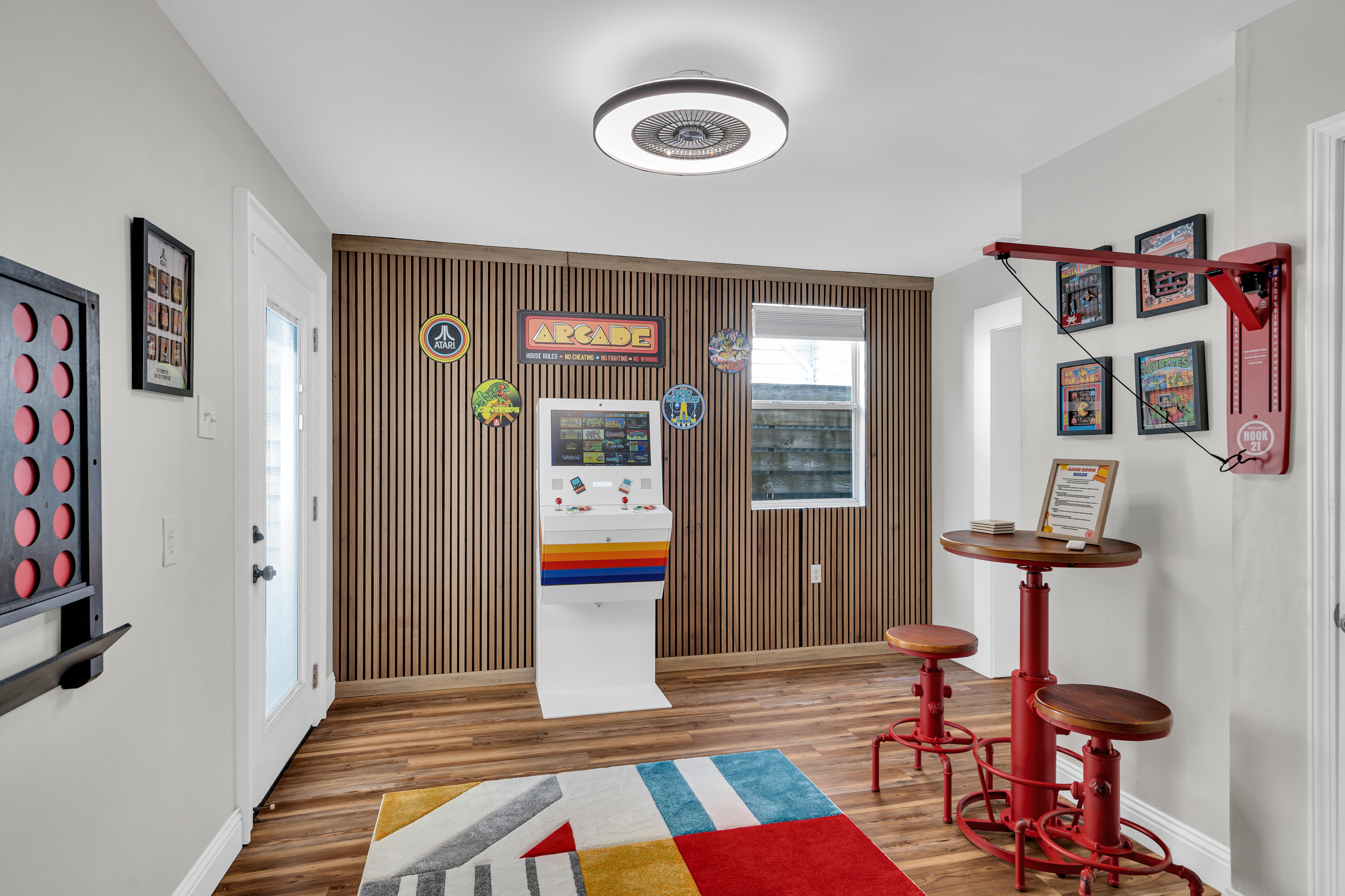 Fun-filled game room with arcade, wall games, and vibrant décor.