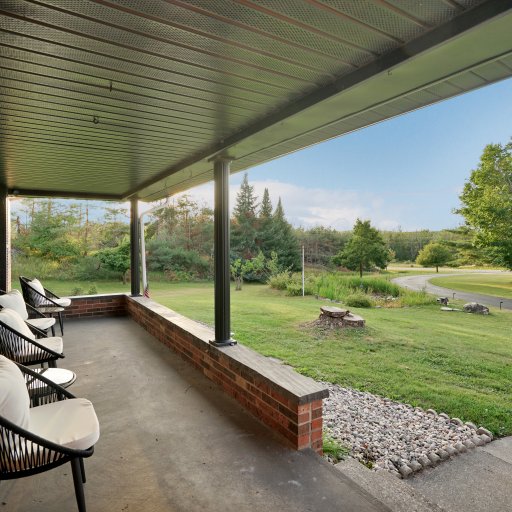 Covered porch with views of the surrounding acreage.