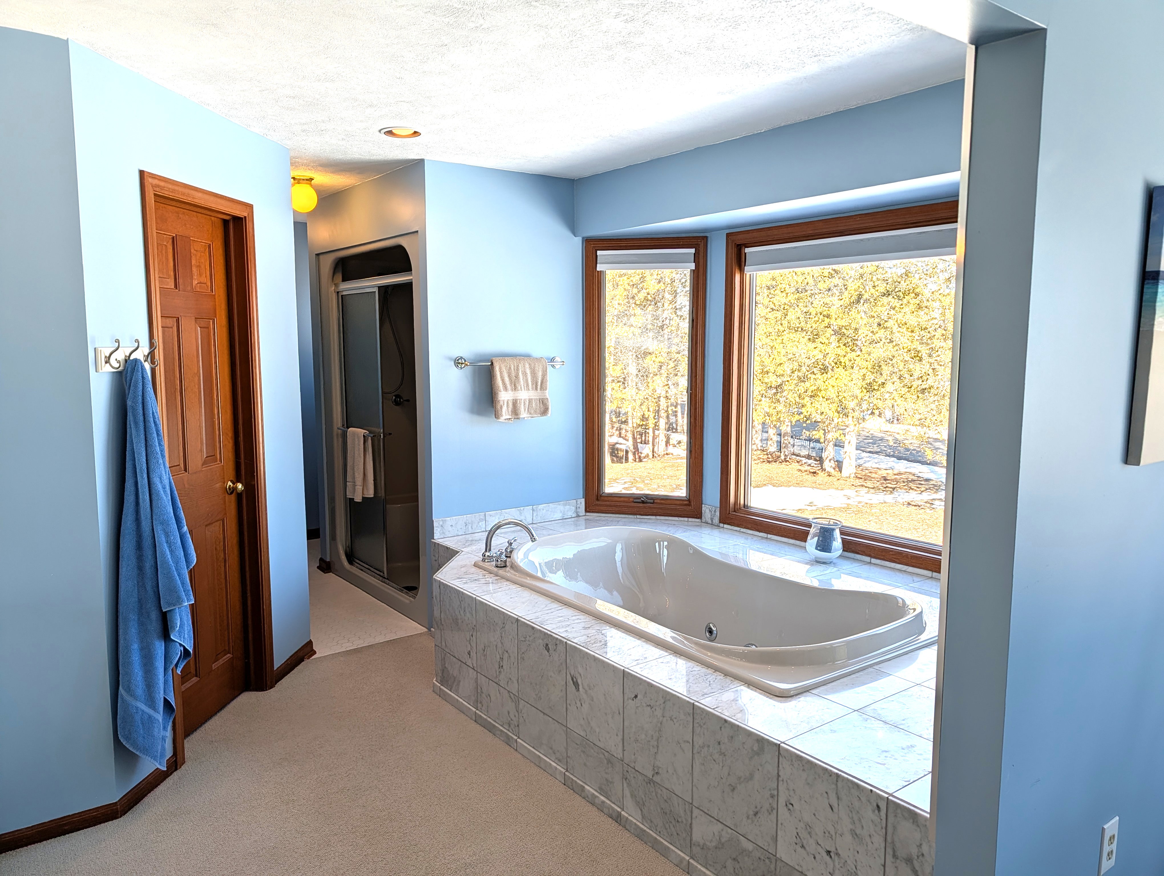 BATHROOM #2 (SECOND FLOOR):  This is a large private ensuite full bathroom for Bedroom #2.  Features a gorgeous jetted bathtub with a great view of Big Platte Lake from the bathtub!