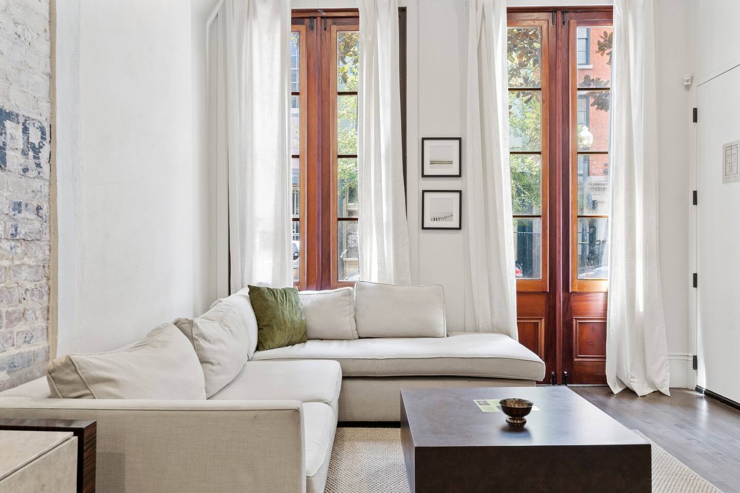 Beautiful sunny living room space equipped with all you need