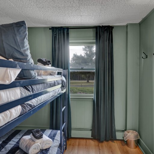 Bedroom with a double-over-double bunk bed.