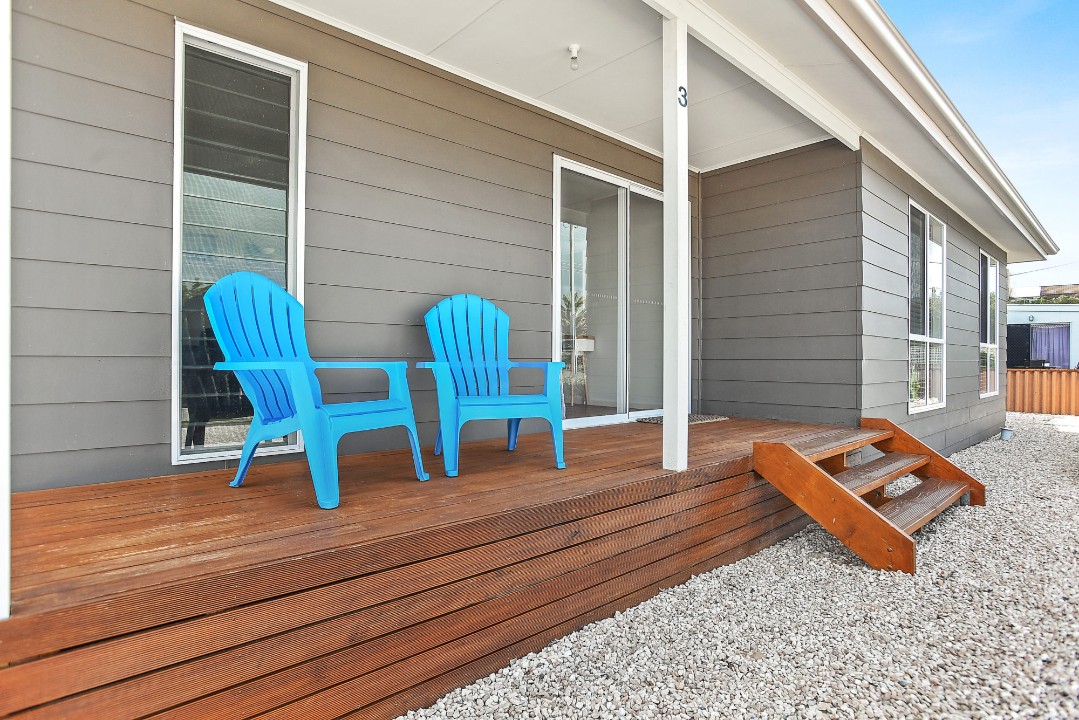 Fully furnished covered deck with BBQ and outdoor furniture, plus a fully fenced rear yard perfect for children.