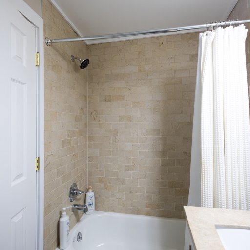Enjoy the full shower and tub combo in the third bathroom—ideal for unwinding after a day of adventure