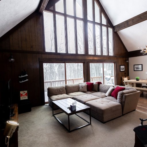 Spacious and inviting, the living room offers vaulted ceilings, a rustic vibe, and room for the whole group to relax.