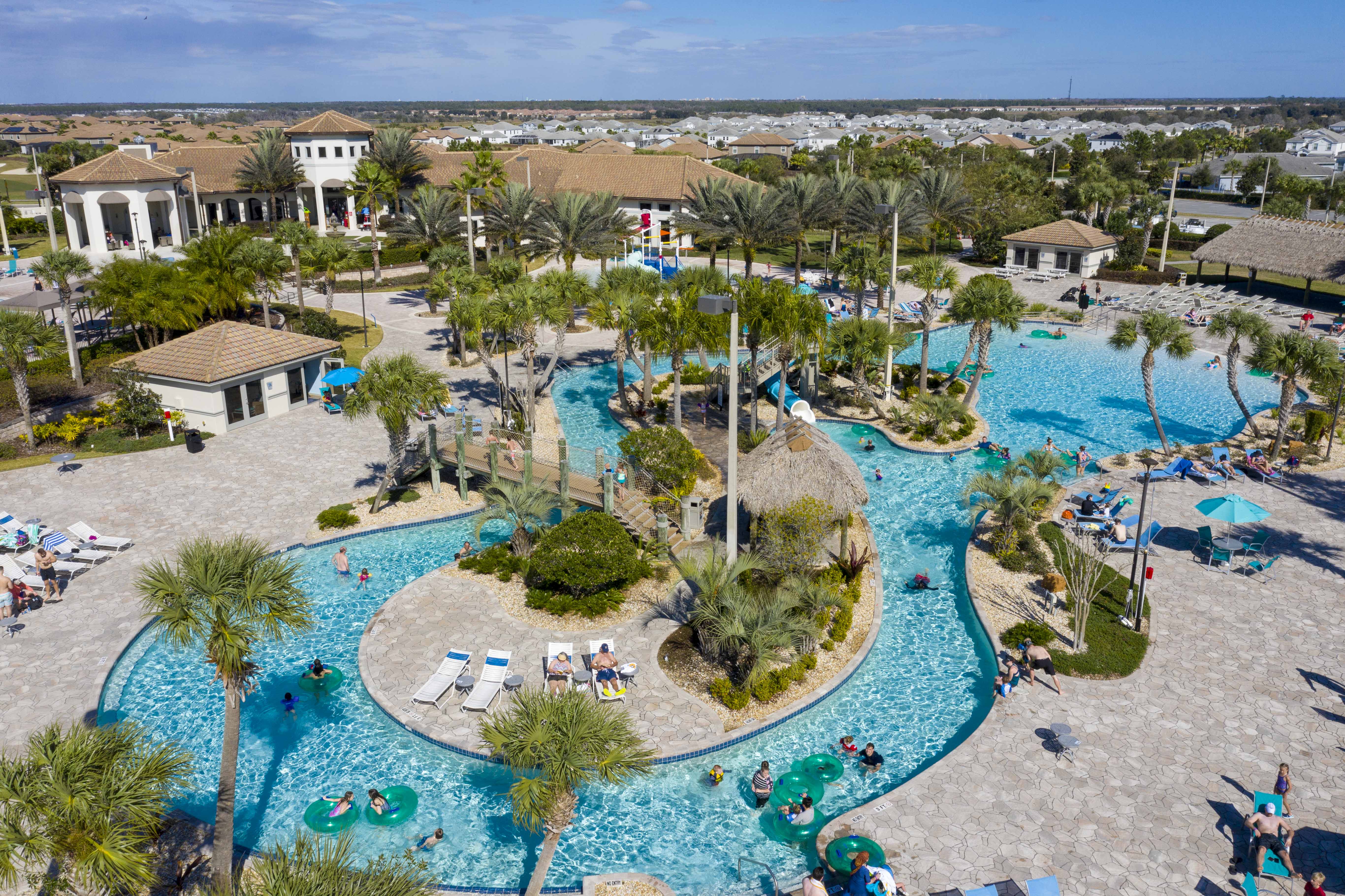 The Oasis Club. Dive into the ultimate family fun with our enticing pool featuring a thrilling water slide and lazy river!  FREE ACCESS INCLUDED!