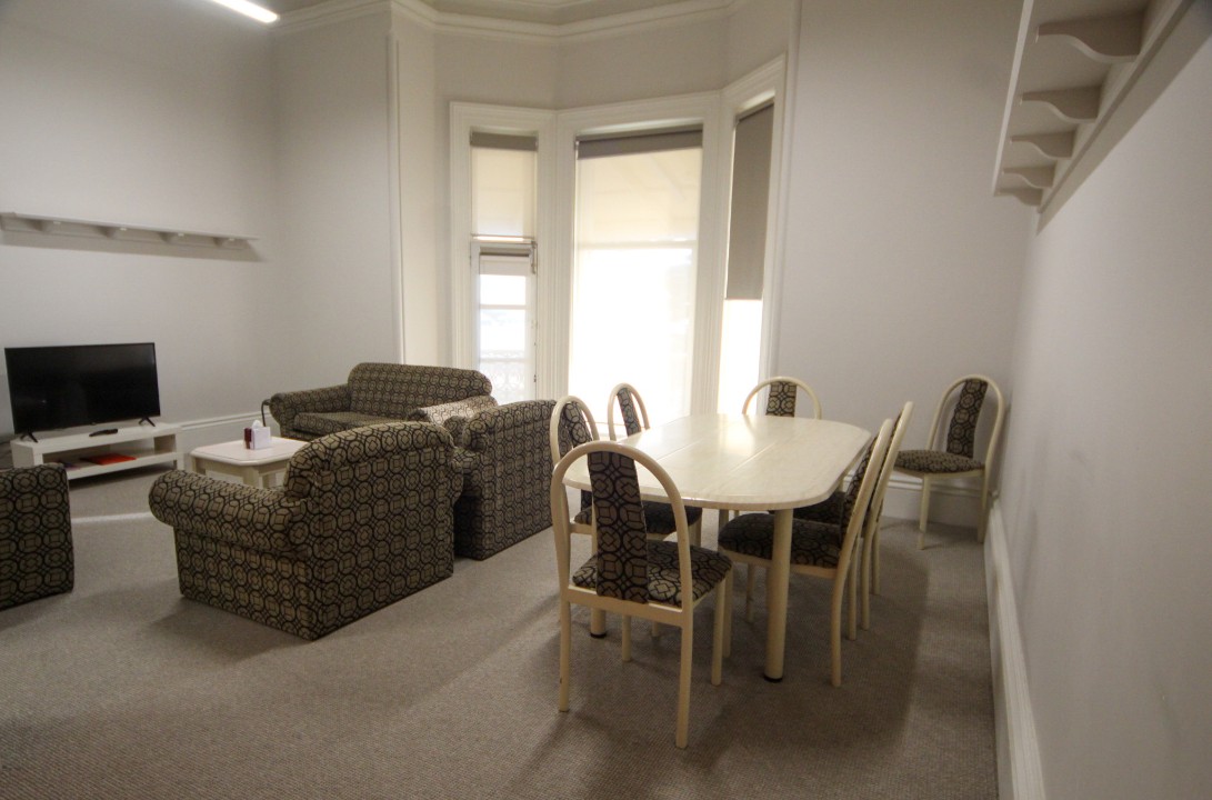 Open plan lounge, dining, and kitchen areas with smart TV, free WiFi, split system air conditioning, modern kitchens, and refurbished bathrooms in each unit featuring contemporary fixtures for guest comfort.