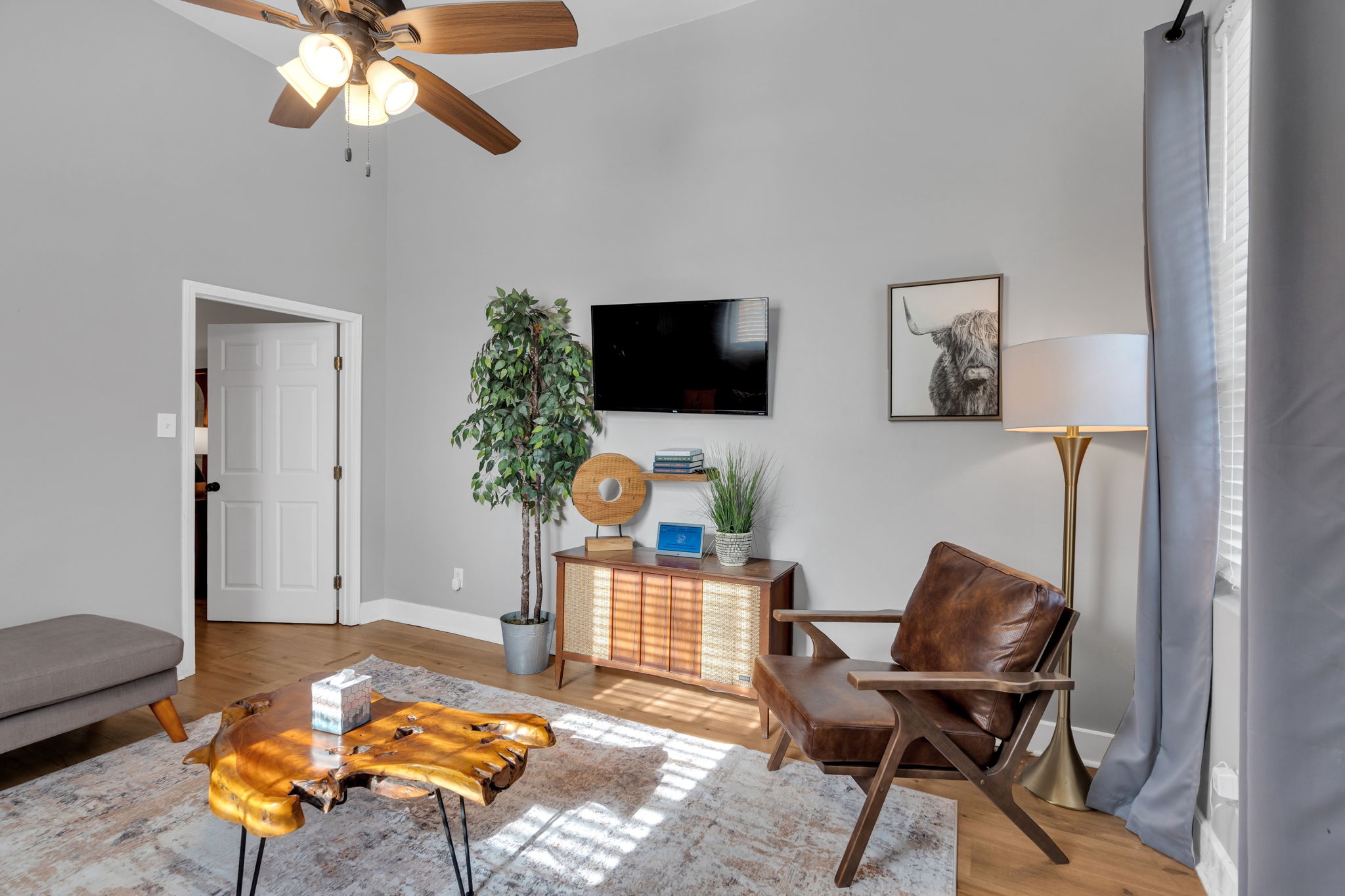 Bright living area with smart TV and cozy seating