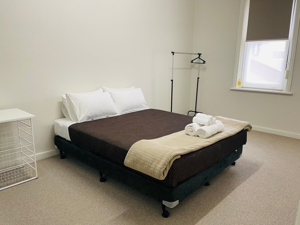 Configured with a Queen-size bed in the master bedroom and a fold-out couch in the living area, accommodating up to 4 guests comfortably.