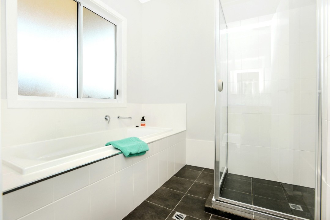 Two Full Bathrooms. Main bathroom with a bathtub for added relaxation and family convenience