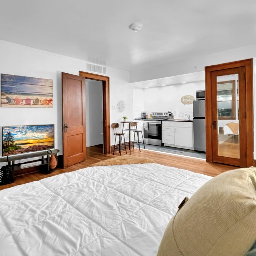 Queen sized plush bed for you to relax and chill while watching TV