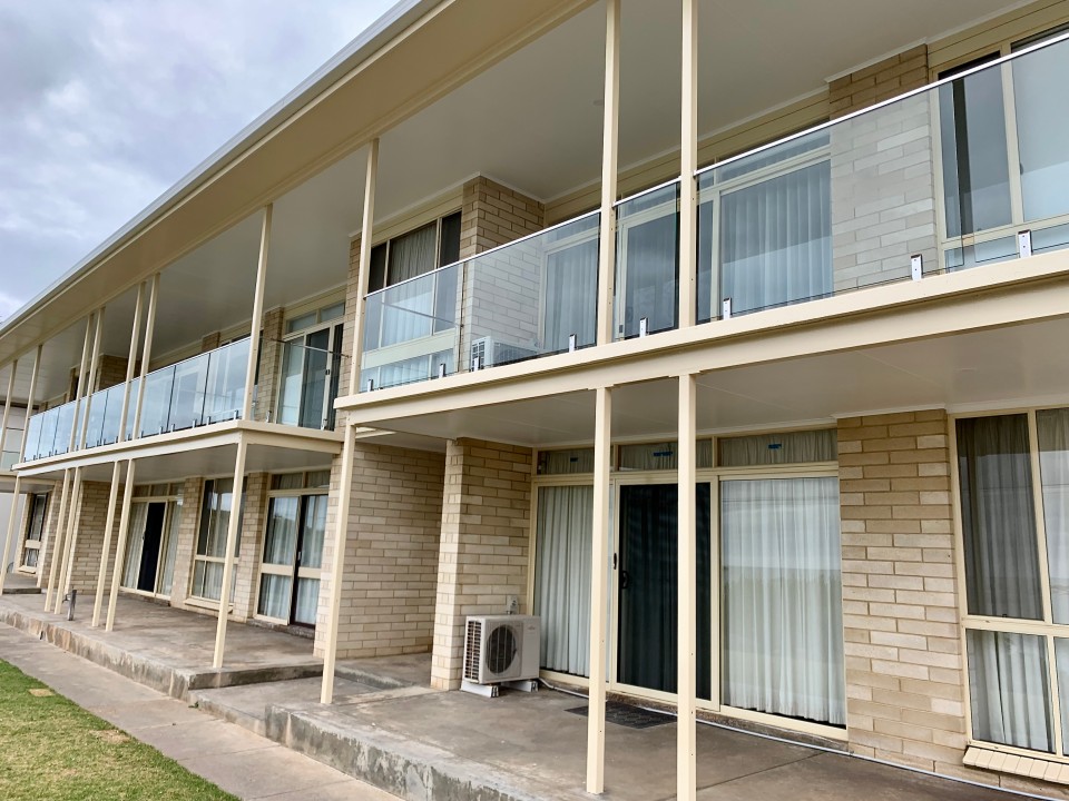 The entire building has been beautifully repainted, enhancing its charm and appeal. Glass balustrades for enhanced ocean vistas