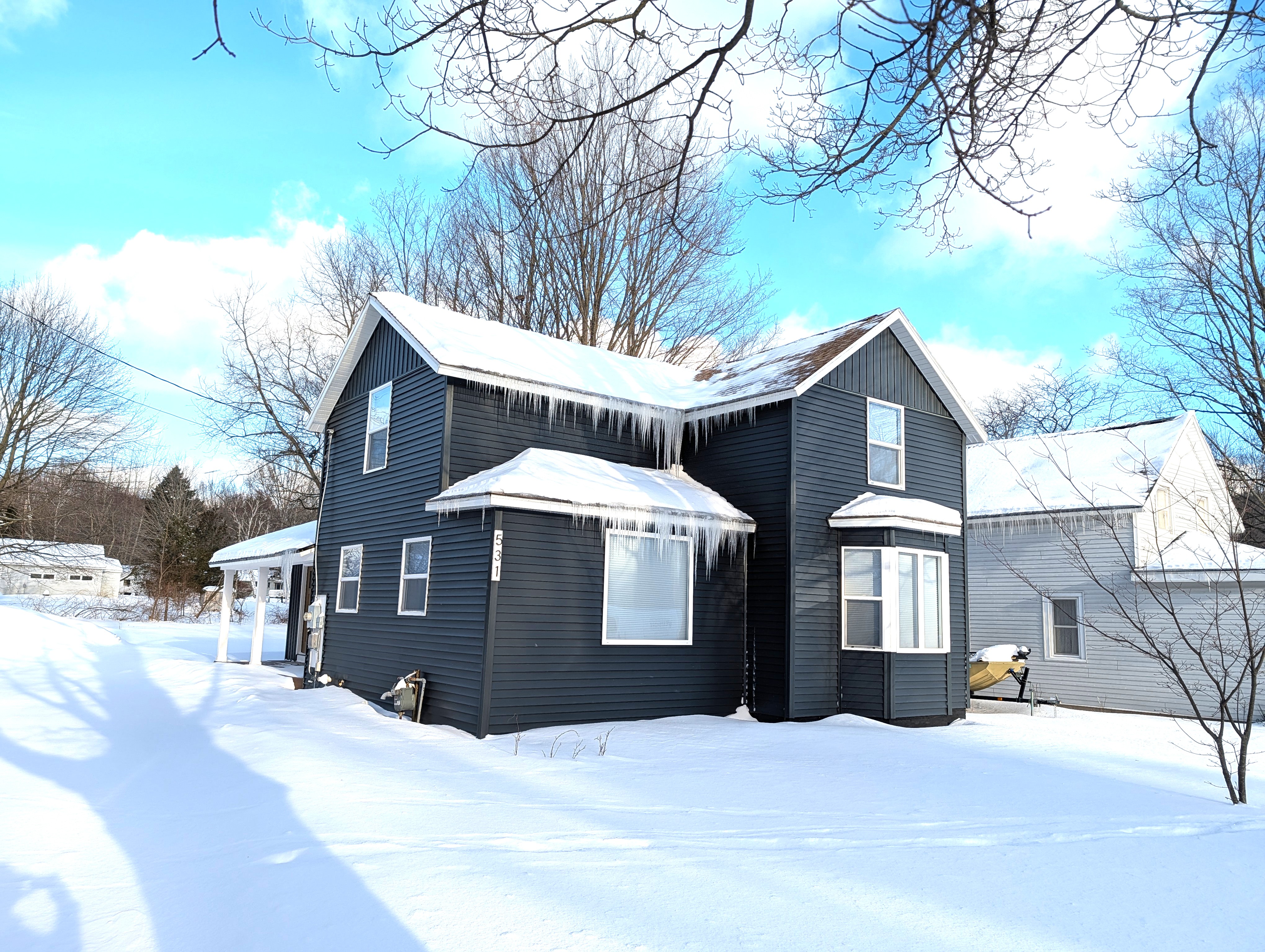 EXTERIOR:  The front of the house in winter