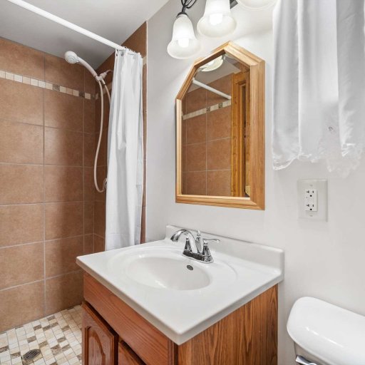 Clean, full bathroom with hot shower and fresh towels — no campground experience here