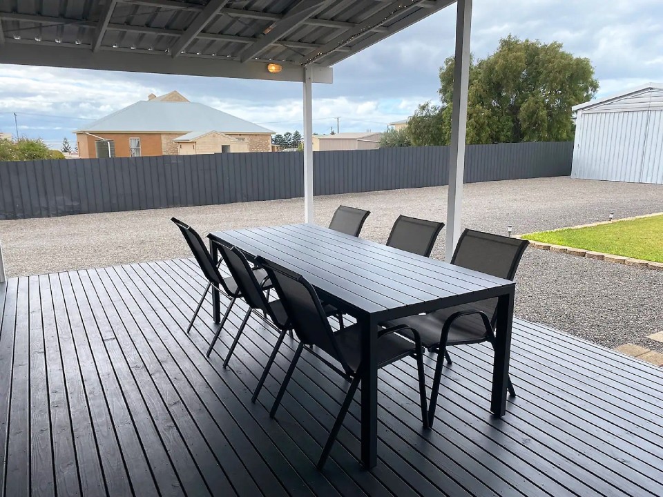 Includes a gas BBQ, ample seating, and a dining area for alfresco meals year-round.