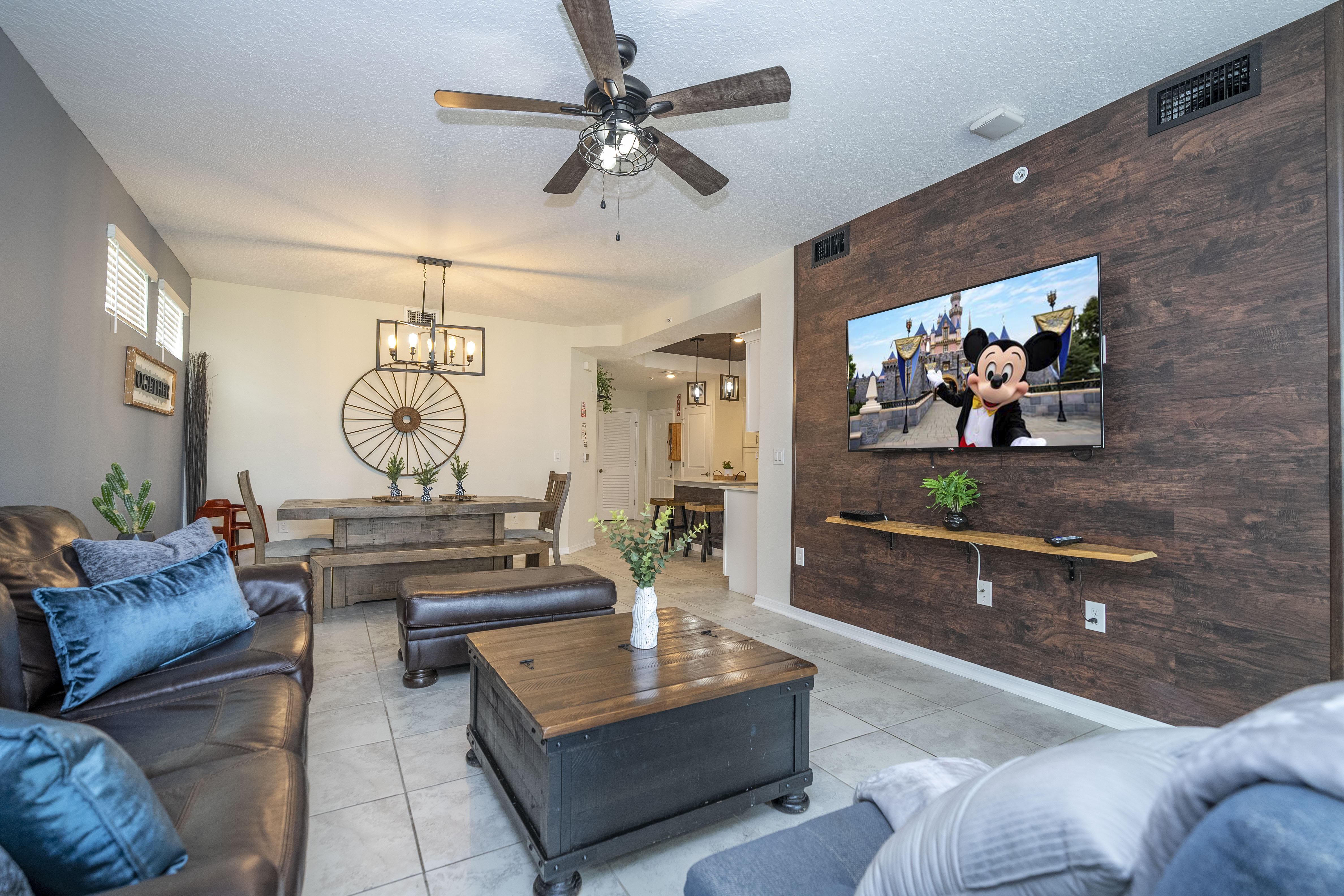 Step into this spacious, comfortable living area. The expansive room is adorned with tasteful decor, offering a blend of modern aesthetics and homey warmth. 